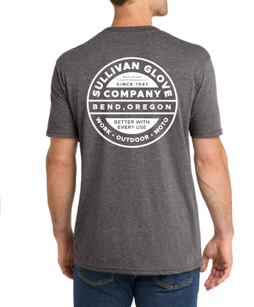 A man wearing a US made t-shirt printed in bend oregon showing a view from behind he's wearing blue jeans