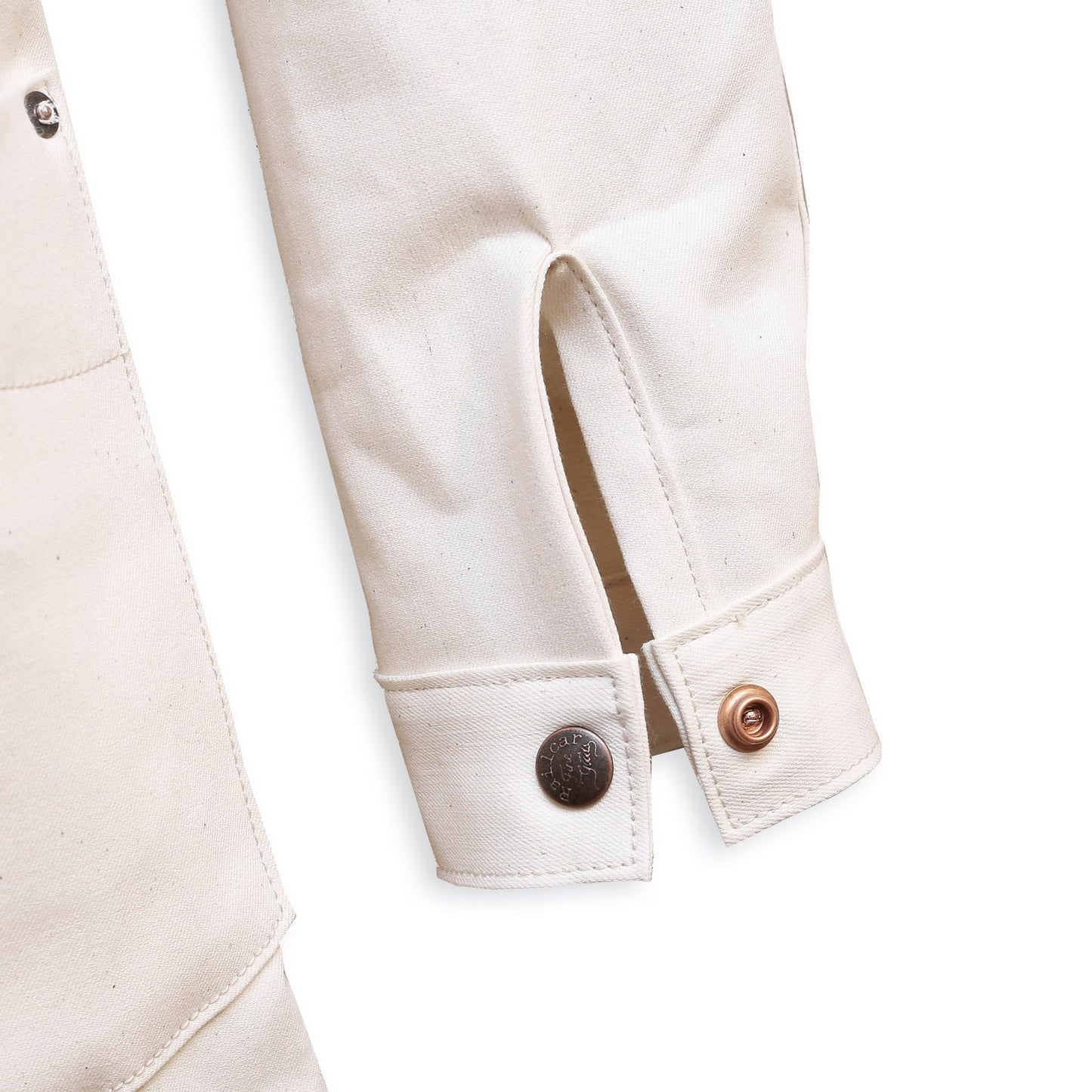 Cuff Detail of a natural seed chore coat with snap buttons