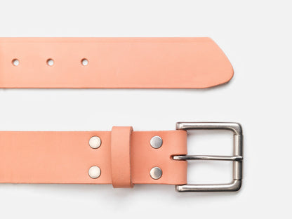 A light tan leather belt with a silver buckle, metal rivets, and multiple adjustment holes, displayed on a white background.