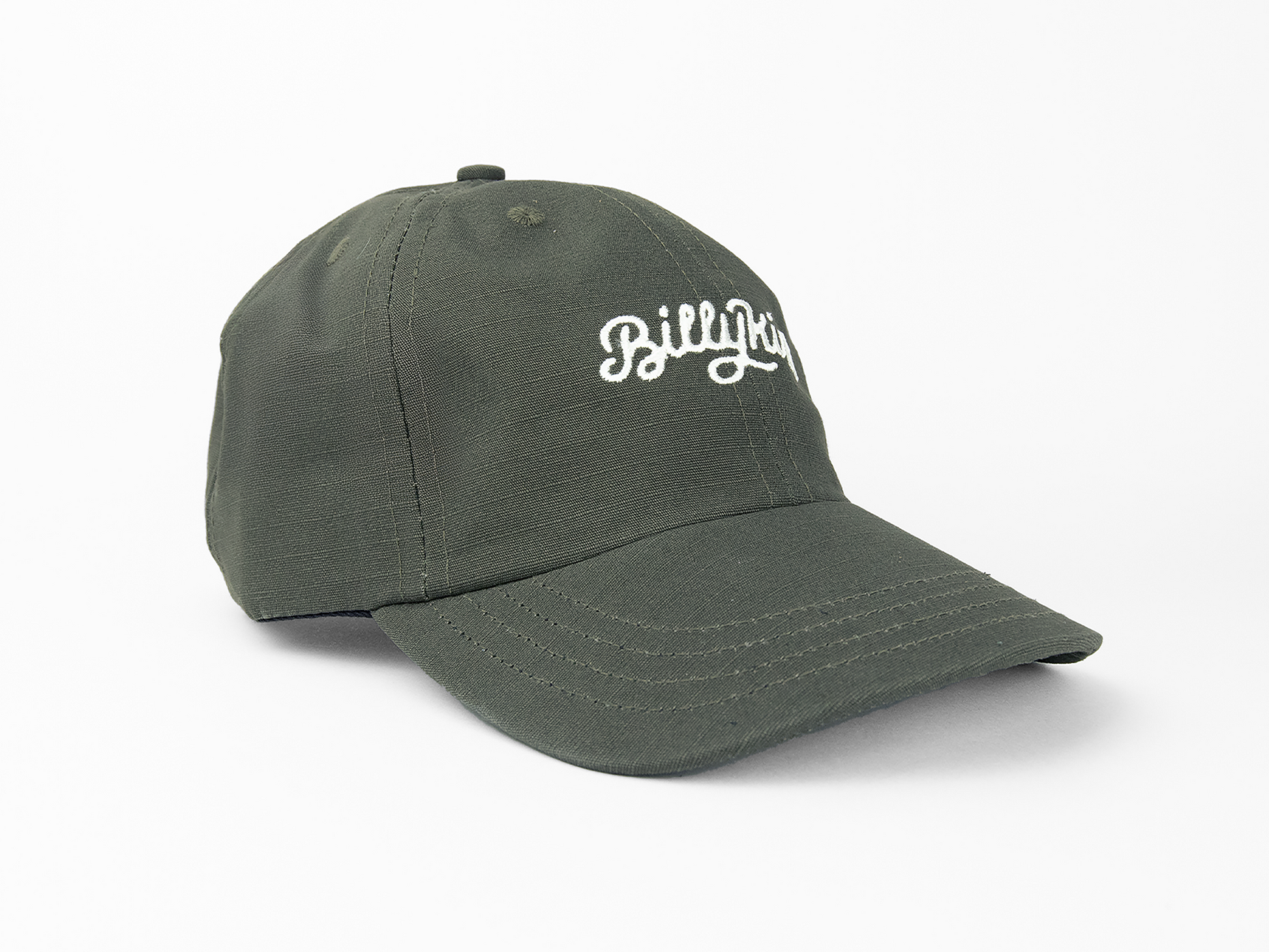 An olive baseball cap featuring a white cursive embroidery on the front that reads “Billykirk”.
