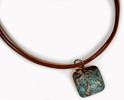 Elaine Coyne Collectible Artwear Verdigris Patina Solid Brass Classic Sea Turtle Pendant on Triple Rawhide by Elaine Coyne -Necklace is USA Made