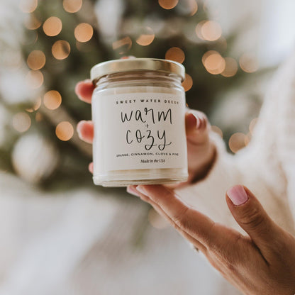 Sweet Water Decor Warm and Cozy Candle - Pine Cinnamon & Fir Winter Scented Soy Candles for Home | 9oz Clear Jar, 40 Hour Burn Time, Made in The USA