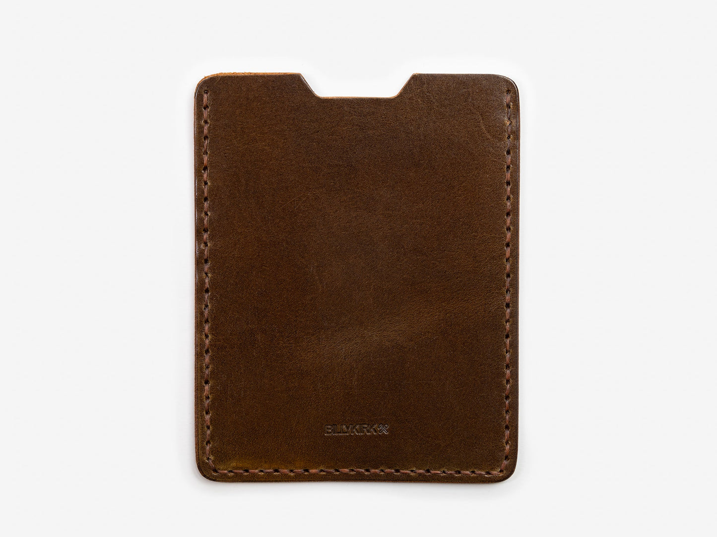 A slim, brown leather card holder with visible stitching around the edges, photographed on a white background.
