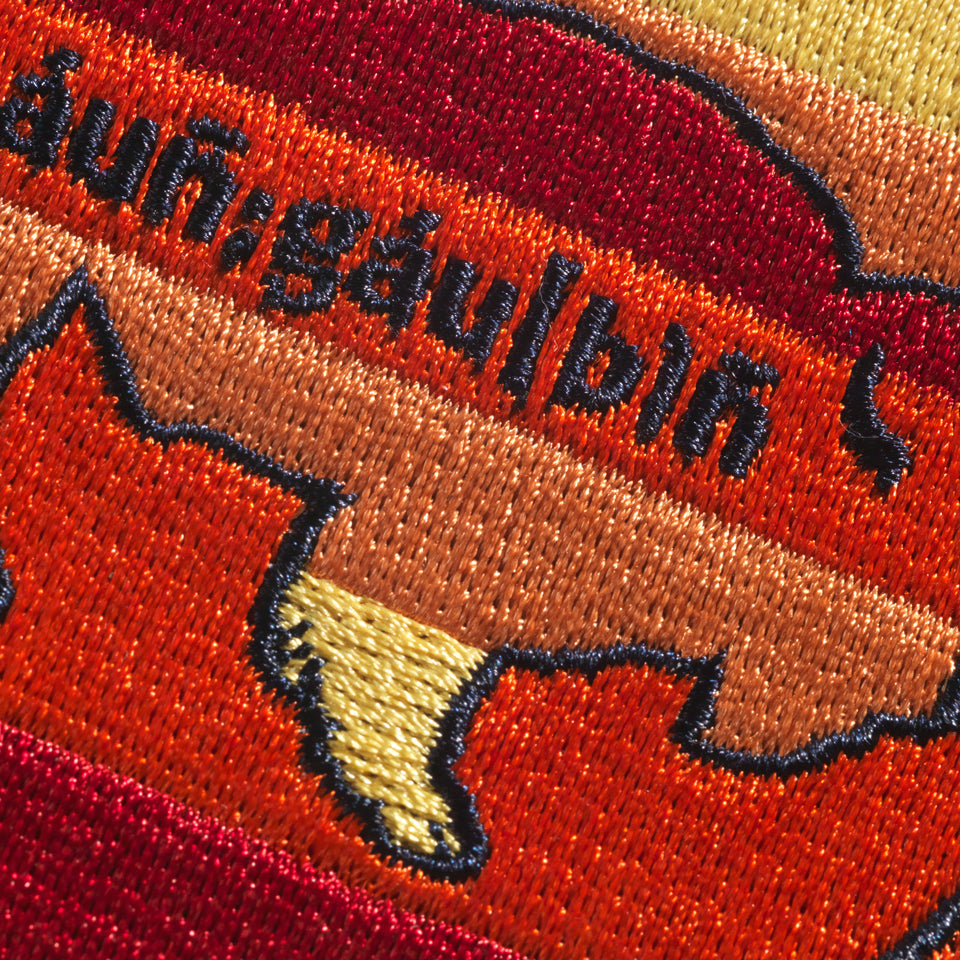 Close up of Large Steven Paul Judd designed sew-on buffalo patch in yellow orange and red.