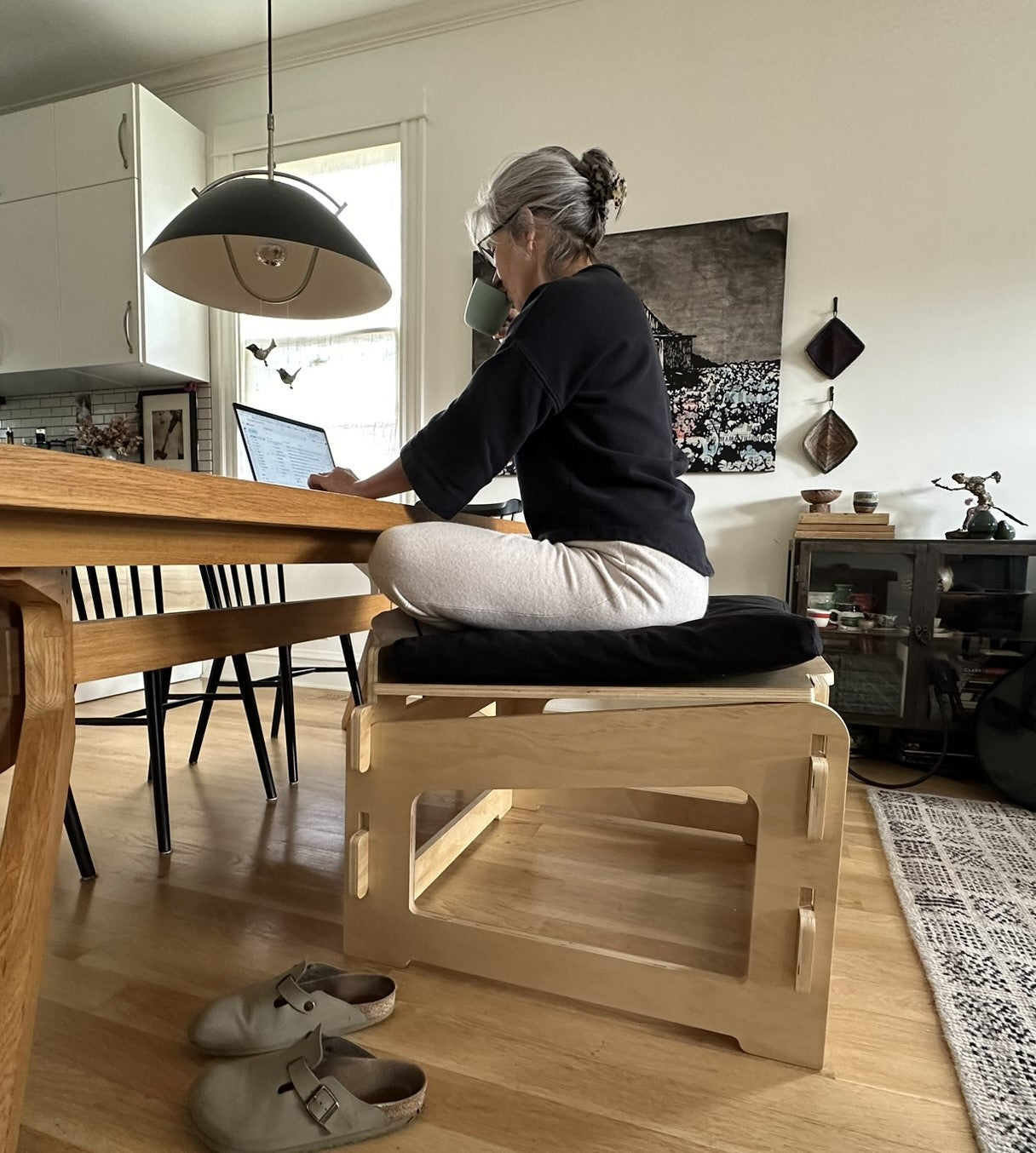 beautiful woman active sitting on higher ground sage meditation desk chair