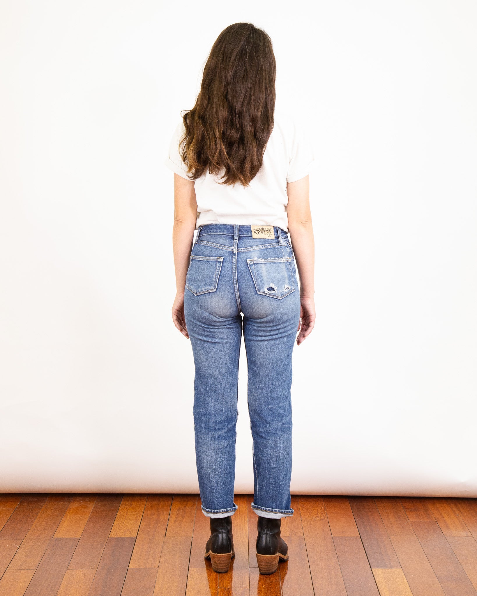 Model Photo of Back of Drifter X061 Pure Indigo Jeans with one year of wear and many consistent washes.