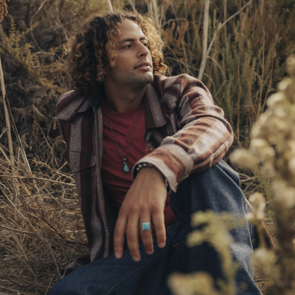 Brown stripe flannel shirt on man at beach dunes