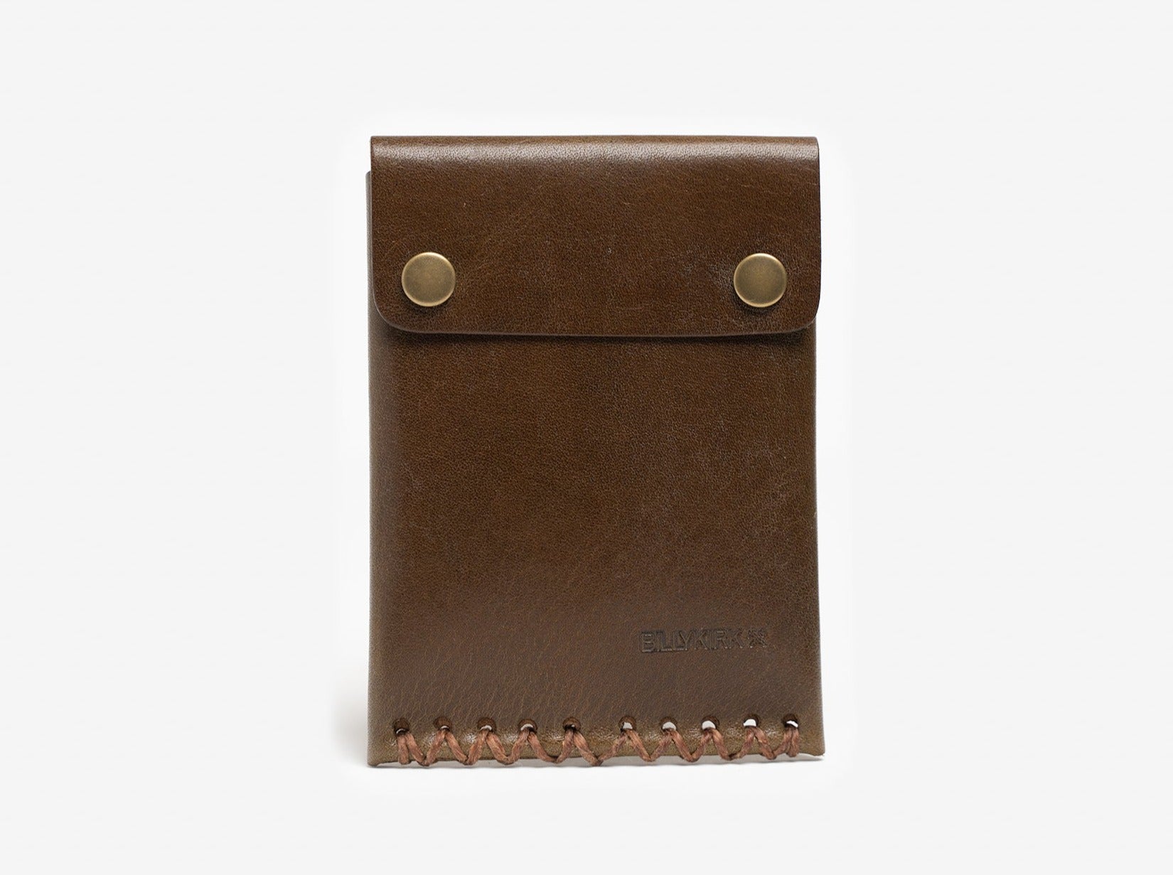A brown leather wallet with two metal snap buttons on the flap and visible stitching along the bottom edge, standing upright on a white background.