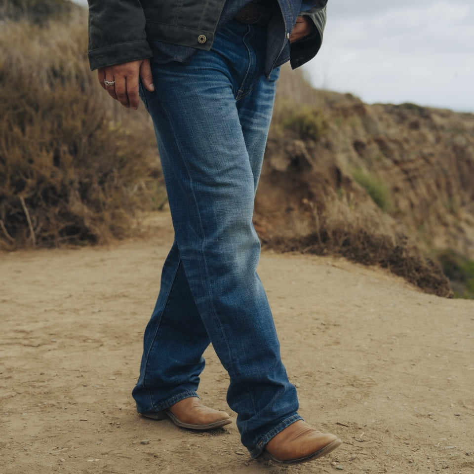 Kurabo denim jeans with a custom wash on male at beach