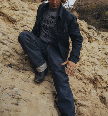 Raw selvedge denim jeans on man hiking