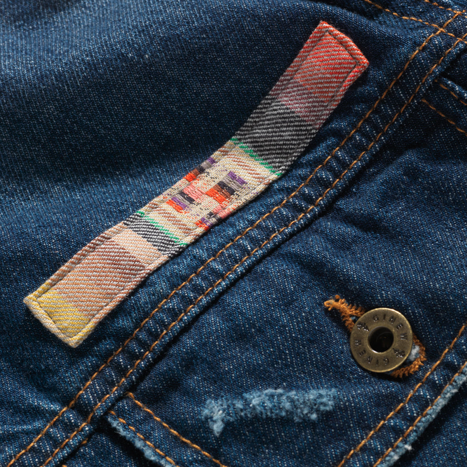 Color band close up on Native American designed denim jacket from Ginew + Steven Paul Judd 