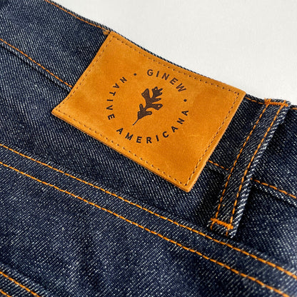 Selvedge denim jean made in USA all cotton close up with leather patch 