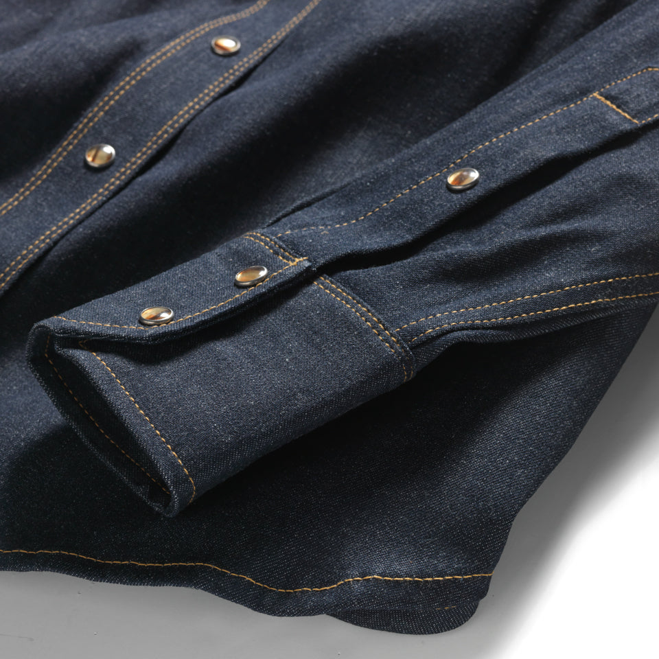 All cotton chambray western snap with faux tortoise shell snaps. Native American Ginew tag inside. 