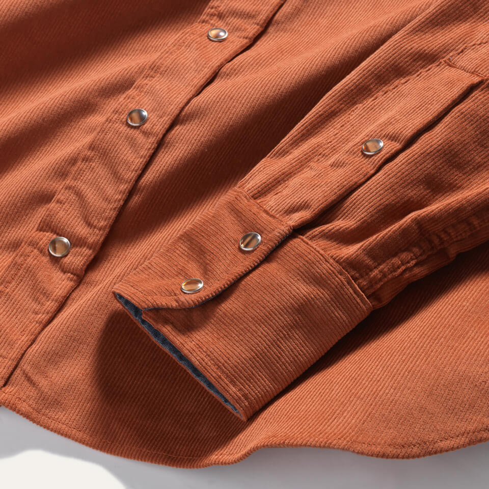 Pearl snaps on burnt orange corduroy cotton shirt