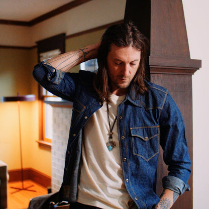 Western Snap shirt in blue with peal buttons on male model