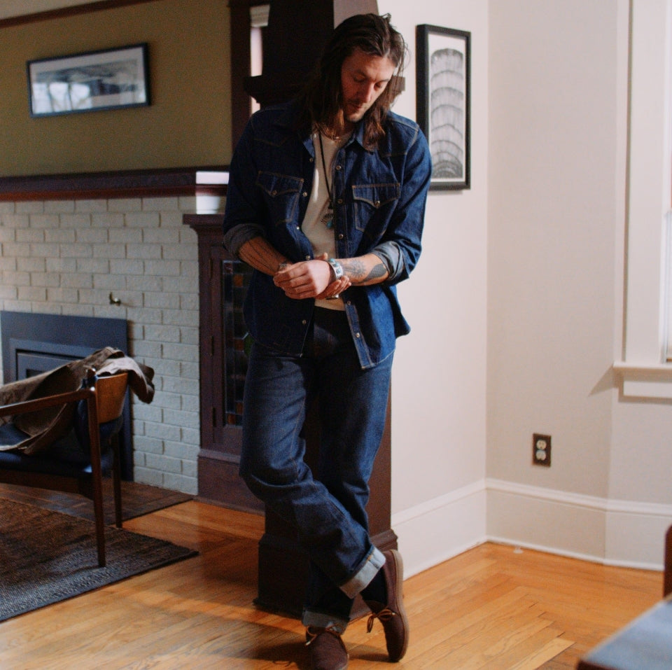 Native American model wearing Western snap button shirt in chambray cotton 