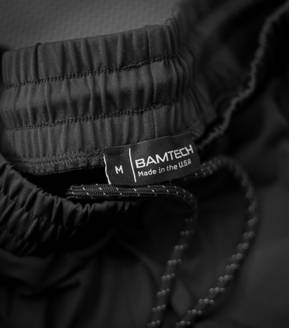Conquer Your Training with Dominate Training Shorts: Unleash Your Potential with the Ultimate Performance Gear. Dominate Training Shorts by Bamtech are Engineered for Peak Performance, Featuring a Sleek and Athletic Design. These Shorts Provide Unmatched Comfort, Flexibility, and Breathability, Empowering You to Push Your Limits. Designed with Premium Sustainable Materials and Made in the USA