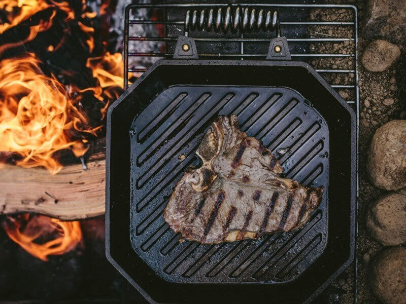Cast iron grill pan with steak