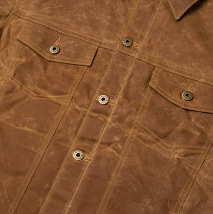 Detail view of front chest pockets and buttons.