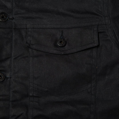 Detail view of front chest pocket on Coat.