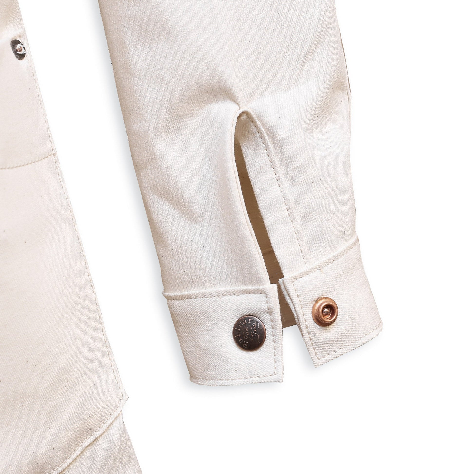 Cuff Detail of a natural seed chore coat with snap buttons