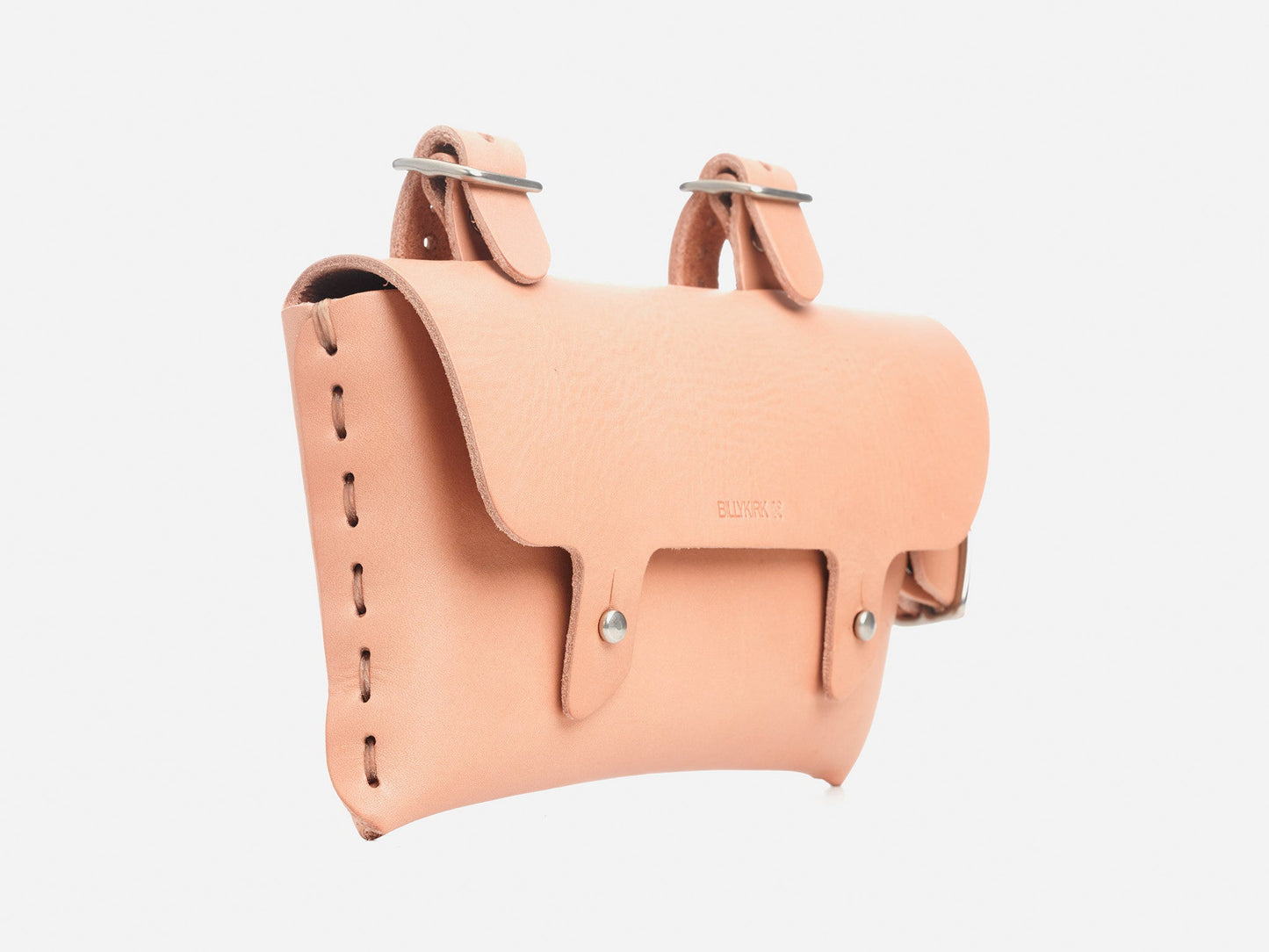 A tan leather bicycle saddlebag with visible stitching, metal rivets, and two buckled straps for attaching to a bike. The bag has a flap closure and a minimalist design.